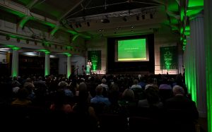 A view of the stage lit up in Green
