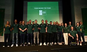 A picture of the support staff on stage all wearing green