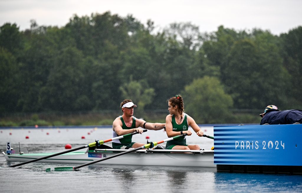 Katie O’Brien (right) and Tiarnán O’Donnell (left) of Ireland sit in their PR2 mixed double sculls boat in the rain before the heats at the Paris 2024 Paralympic Games at Vaires-sur-Marne.