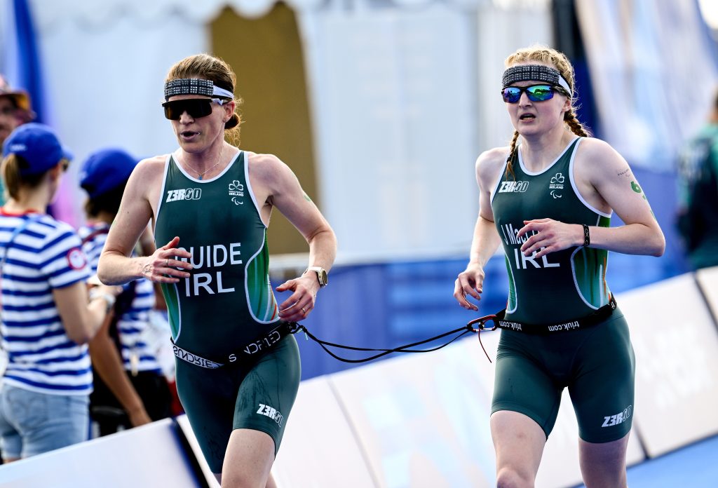 Judith MacCombe, right, and guide Eimear Nicholls, left, competing during the run segment of the PTVI triathlon event at Paris 2024