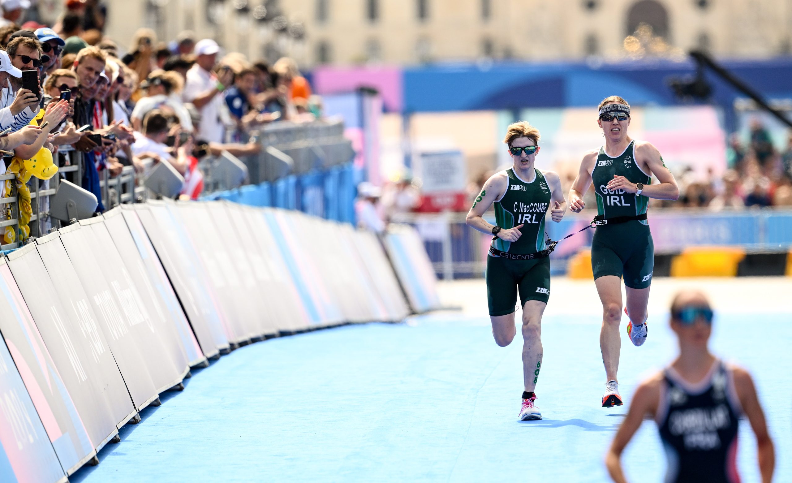 2 September 2024; Chloe MacCombe, left, and guide Catherine A Sands of Ireland on their way to finishing in sixth place in the women's PTVI race on day five of the Paris 2024 Paralympic Games at Pont Alexandre III in Paris, France. Photo by Ramsey Cardy/Sportsfile *** NO REPRODUCTION FEE ***