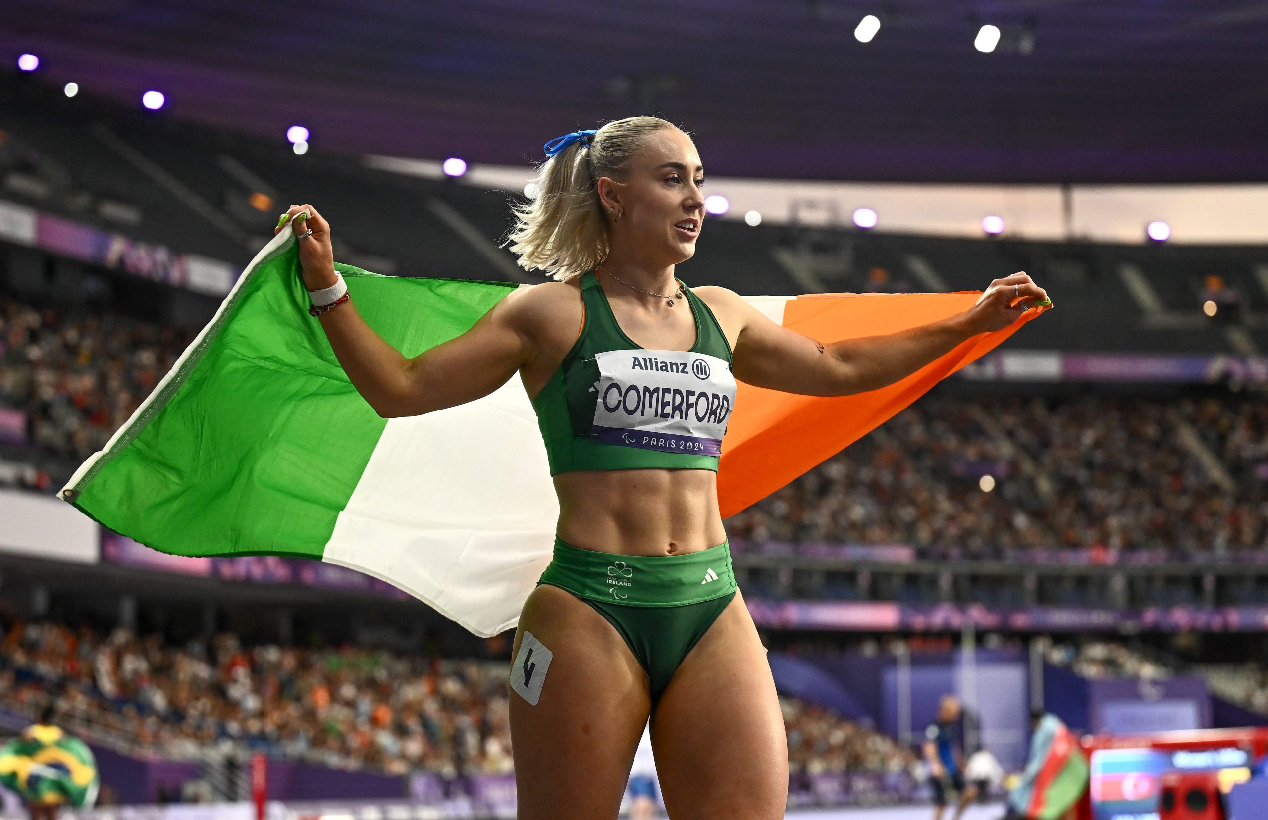 3 September 2024; Orla Comerford of Ireland celebrates after winning a bronze medal in the women's T13 100m final on day six of the Paris 2024 Paralympic Games at Stade de France in Paris, France. Photo by Harry Murphy/Sportsfile *** NO REPRODUCTION FEE ***