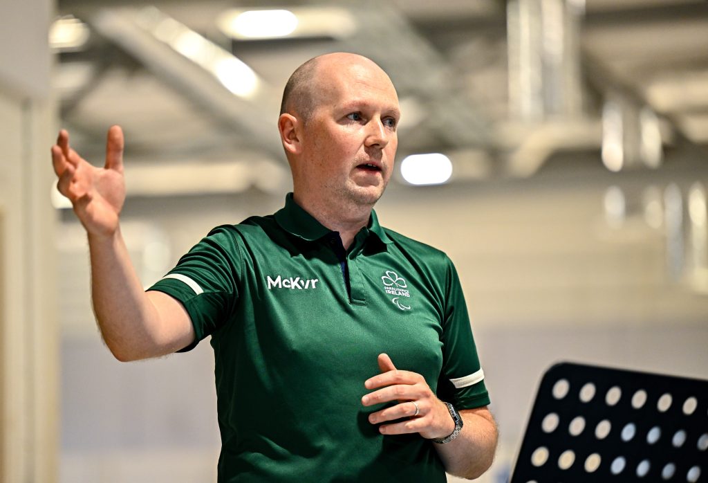Paralympics Ireland Performance Operations Manager Richard Doyle speaks while gesturing during the European Youth Games 2025 team photo shoot in Dublin.