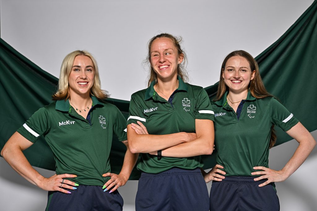 From left, Orla Comerford, Greta Streimikyte and Lana Sutton, pictured at the Sport Ireland Institute on the Sport Ireland Campus in Dublin. Green t shirts hands on hips all smiling,
