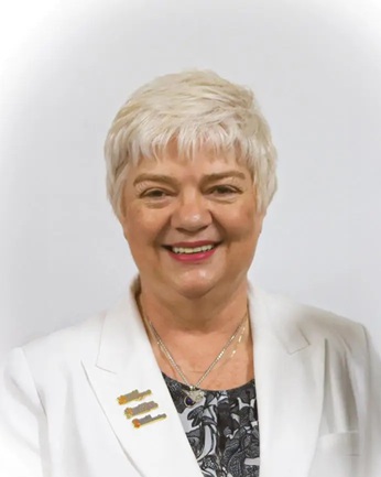 Headshot of Charmaine Hooper wearing white jacket