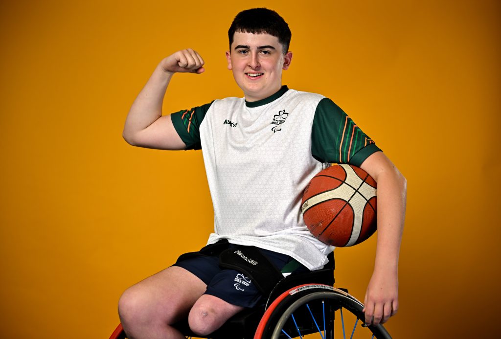 Wheelchair basketball player Conor Dufficy poses in his sports wheelchair with a basketball during the European Youth Games 2025 team photo shoot at the Sport Ireland Campus in Dublin.