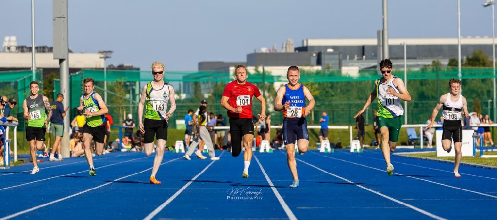 Athletes compete in the men’s ambulant 100m on the blue track at the UCD Inclusive Meet in Dublin.