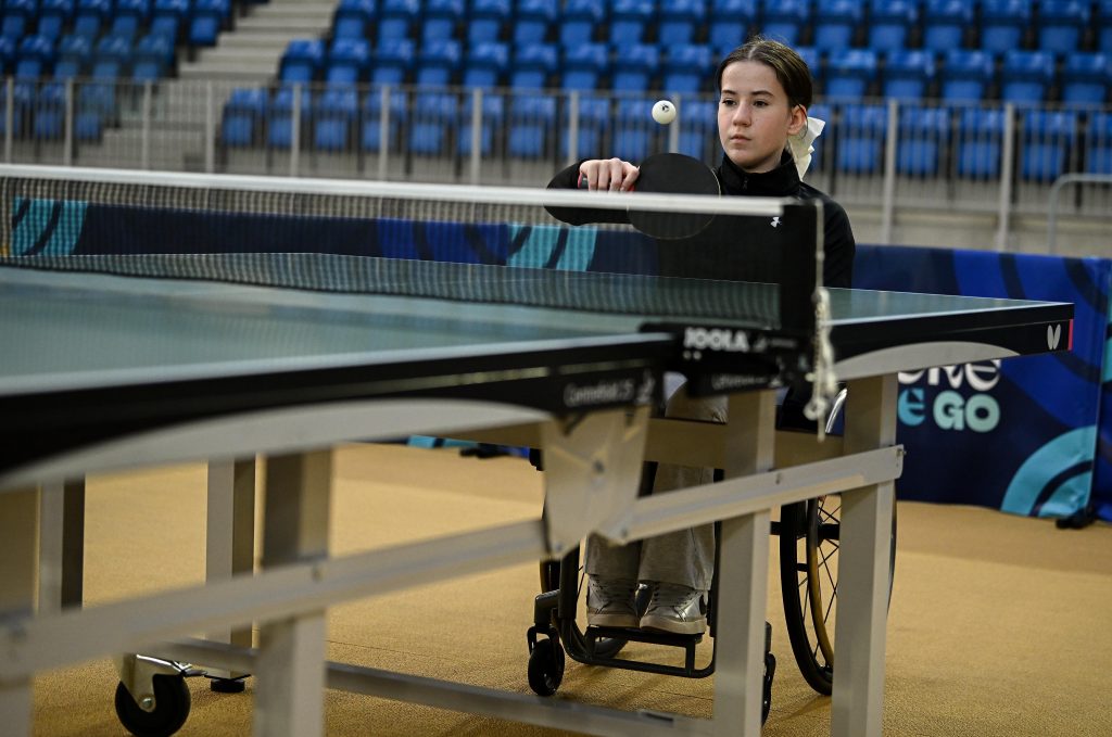 Young athlete in a wheelchair trying out Para table tennis