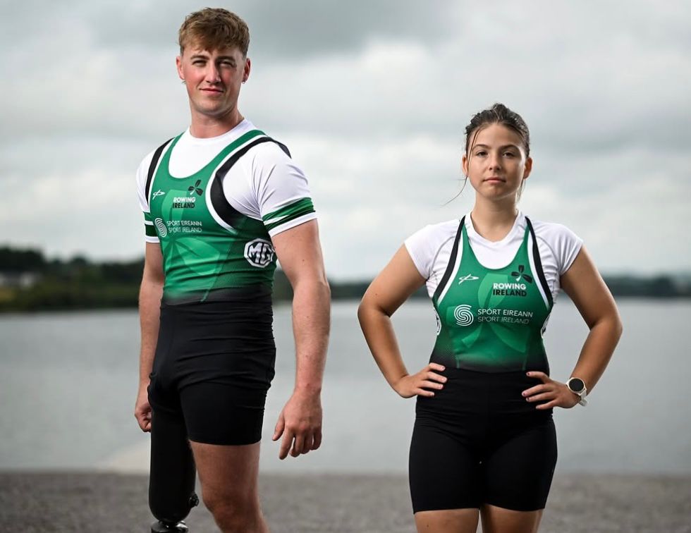 Tiarnan O Donnel Sadhbh Ní Laoghaire in Irish rowing kit posing for team pic. Both looking serious