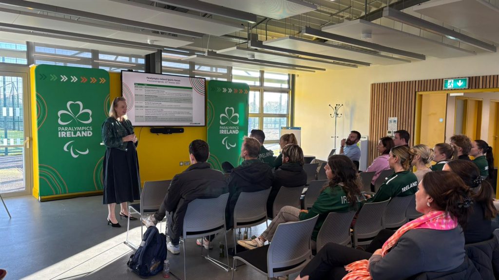 Paralympics Ireland president Lisa Clancy speaking from the front of a room to a group of people seated in front of her